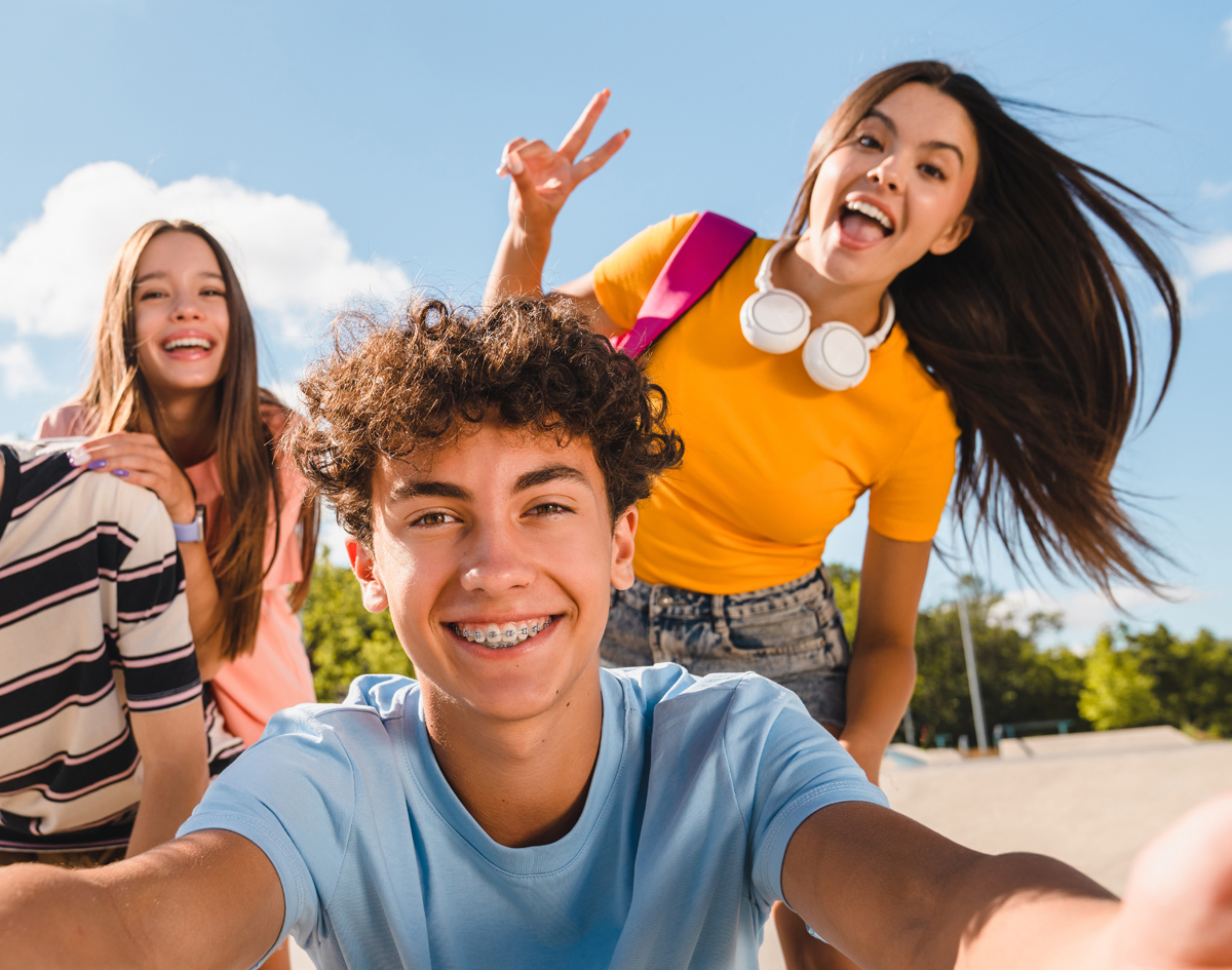 Michael-Riordan-Orthodontics-group-of-teens-smiling